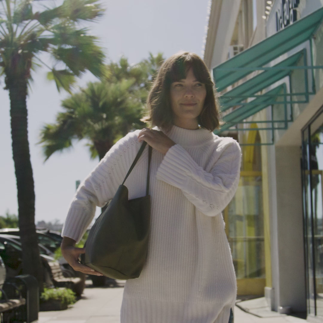 Women showcasing ORSYN bags in real life setting.